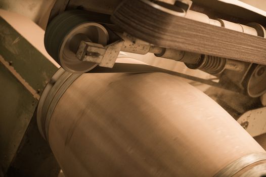 Cleaning a barrel with a sanding machine, Bordeaux Vineyard, France