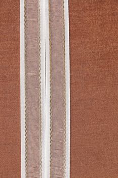 white ribbon on natural cotton, bright cloth fabric background. Retro style