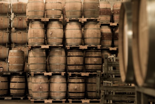 Wine barrels stacked in cellar, Bordeaux Vineyard, France