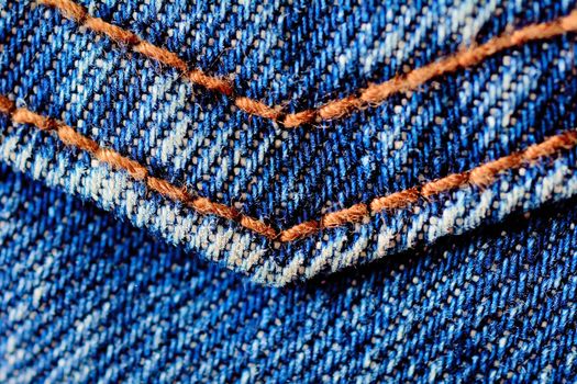 Blue jeans macro. Jeans fabric texture. Seam on jeans.