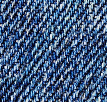 Blue jeans macro. Jeans fabric texture. Seam on jeans.