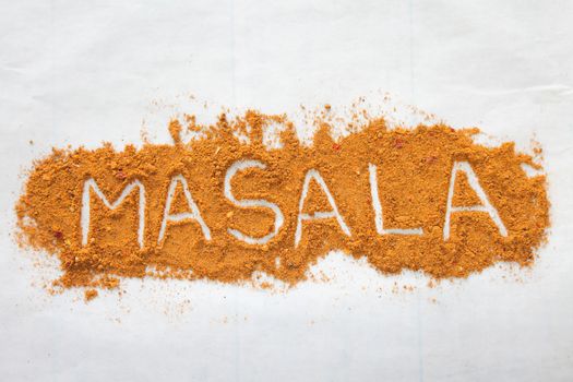 Masala text font written in negative with spices