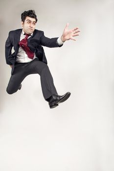 Man in suit jumping running