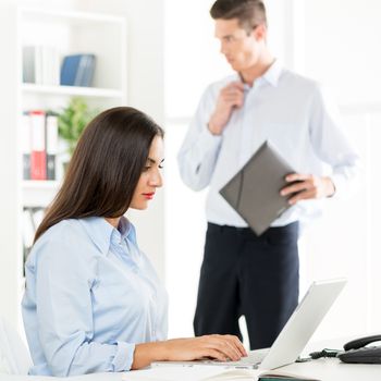 Beautiful young Businesswoman working on laptop in the office. Selective focus.