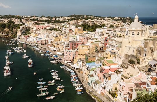 view of the harbour and the colored buildings in Procida, Naples