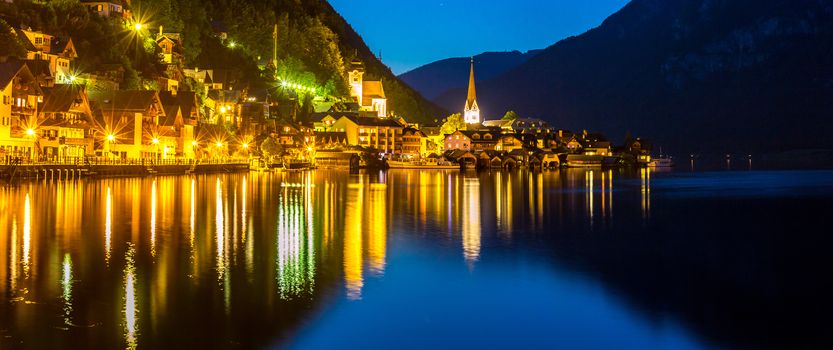 Classic view of Hallstatt village in Alps at dusk, Austria