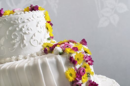 Wedding cake withe with flowers pink and yellow