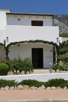 A holiday hotel in tropical gardens, Sardinia island, Italy. 