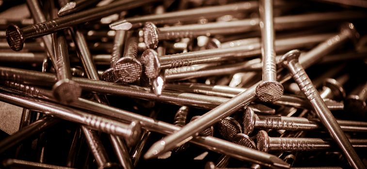 Carpenter long nails on a table closeup