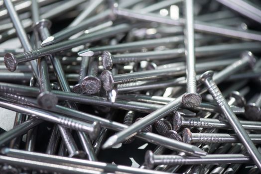 Carpenter long nails on a table closeup