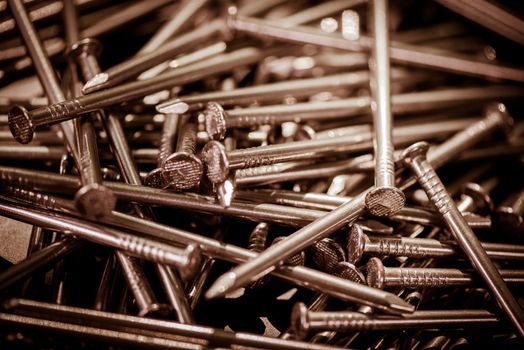 Carpenter long nails on a table closeup