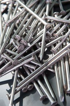 Carpenter long nails on a table closeup