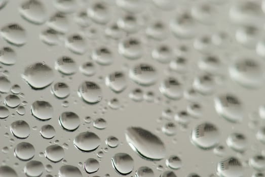 close-up of water drops on the blue background.