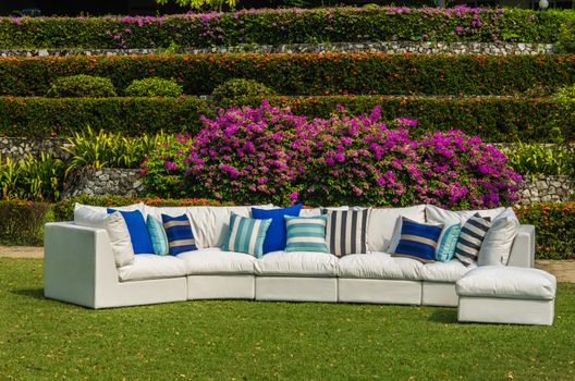 Water resistant outdoor sofa with cushions and pillows