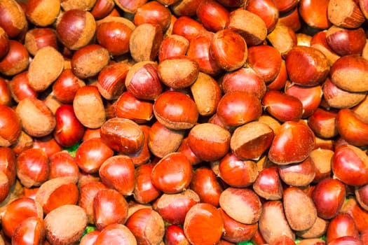 Pile of chestnuts. Autumn background.
