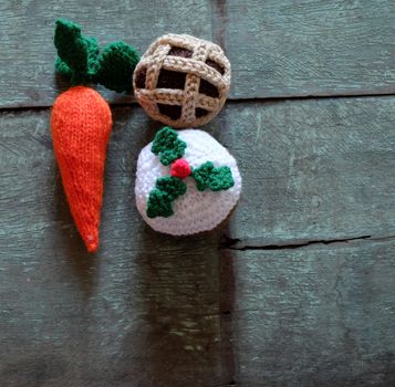 Group of food as carrot, mince pie, cupcake, meal to treat for santa claus and rudolph on christmas night, amazing xmas ornament handmade by knit from colorful yarn