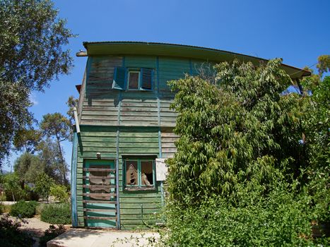 Old weathered abandoned western colonial style wooden house shed