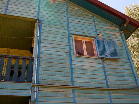 Details of an old weathered abandoned western colonial style wooden house shed