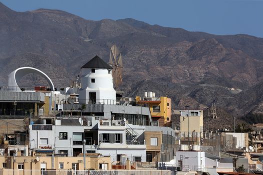 Rooftop windmill in the Mediterranean port of Aguilas on the Costa Calida in Murcia in southeastern Spain