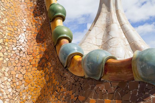 Barcelona, Spain - May 11,2016 : Casa Batllo,  housetop , details with ceramic mosaic. Building  redesigned in 1904 by Gaudi located in the center of Barcelona, it  is on the UNESCO World Heritage Site.
