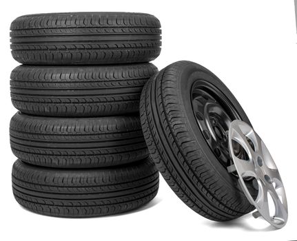 Closeup of five tires with wheel cap, isolated over white background