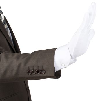 Mans hand in white glove showing stop gesture isolated on white background
