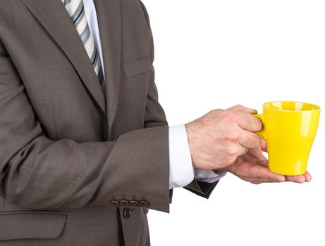 Business man holding yellow cup of black coffee in caffeine addiction concept isolated on white