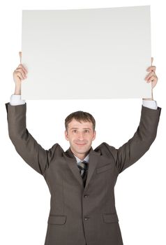 Happy young businessman holding blank paper above his head isolated over white background
