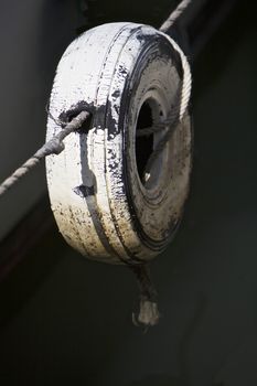 Weathered old tire in the harbor, Melbourne, Australia