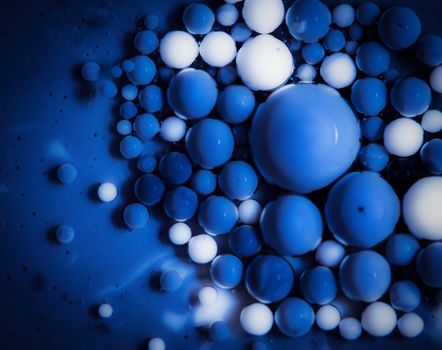 abstract background colored balls blue drops in oil