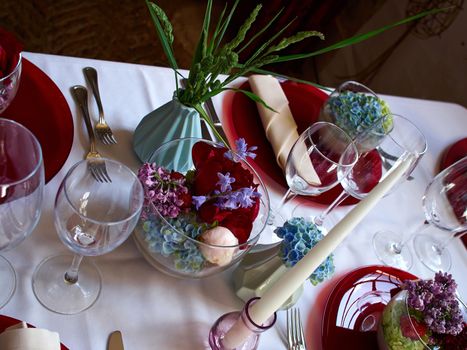 Beautiful festive creative colorful table setting in a restaurant hotel