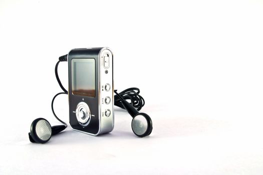mp3 player and headphones isolated on white background 
