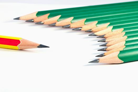 lower view of green  pencils on white background 