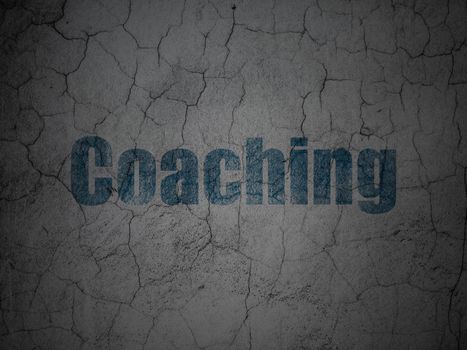 Education concept: Blue Coaching on grunge textured concrete wall background