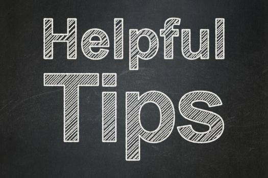 Learning concept: text Helpful Tips on Black chalkboard background