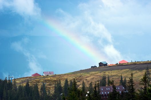 Mountain landscape with a rainbow