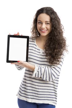 Beautiful and happy woman showing something on a tablet