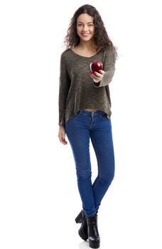 Portrait of a beautiful woman holding a fresh red apple, isolated in white background