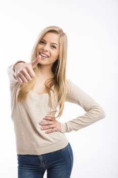 Beautiful and happy teenage girl with thumbs up, isolated over white background 
