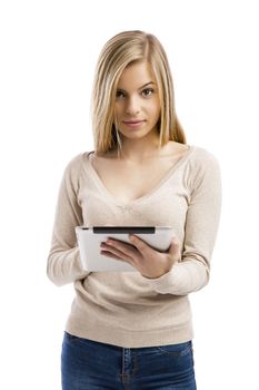 Beautiful and happy girl working with a tablet, isolated over white background 