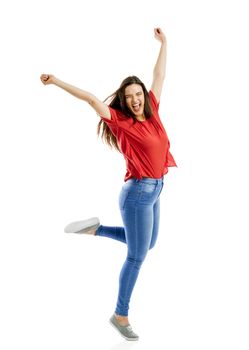 Lovely happy woman jumping of joy 