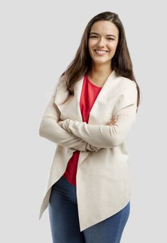 Lovely woman smiling at the camera with her arms folded