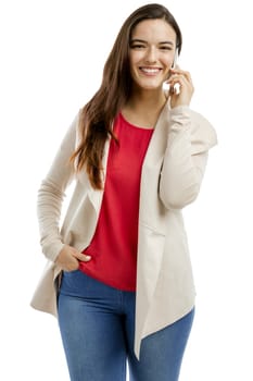 Beautiful woman talking on the phone, isolated over white background