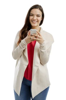 Beautiful woman sending a text message, isolated over white background