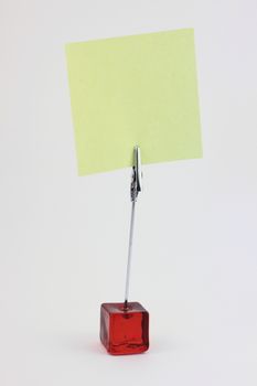 Red glass note-holder with alligator clip and blank yellow note