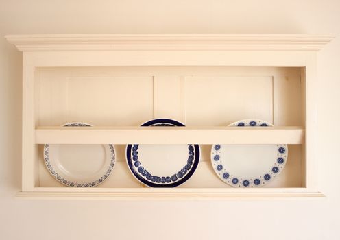 Old plateholder with three plates in summerhouse in Denmark