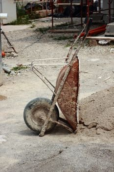 Wheelbarrow at construction site in siesta time
