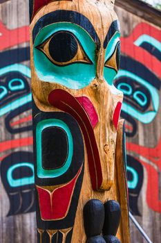 Moon Raven totem pole at Saxman Village tribal house near Ketchikan Alaska