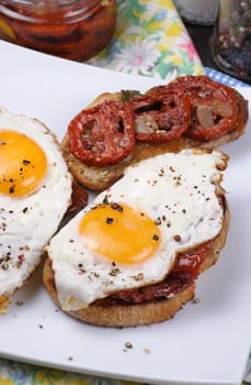 Sandwich with slices of dried tomatoes and egg flavored spices 