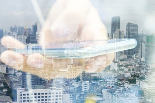 Double exposure image of businessman using smart phone with cityscape background, Business technology concept.
